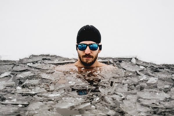 man bathing in ice